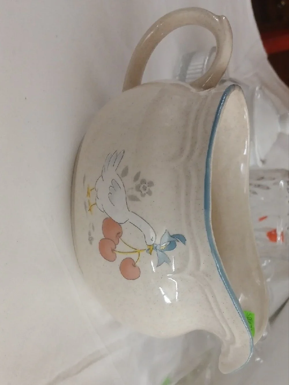 Cream Ceramic Pitcher with Blue Trim and Dove Motif